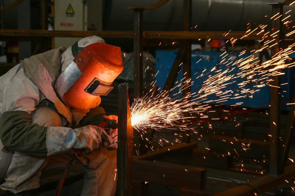 A worker welds a liquefied natural gas (LNG) tank parts at a factory in Nantong in China’s eastern Jiangsu province. Photo: STR/AFP/Getty Images