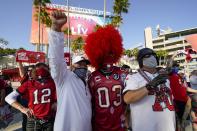 Fans pose before the NFL Super Bowl 55 football game between the Kansas City Chiefs and Tampa Bay Buccaneers, Sunday, Feb. 7, 2021, in Tampa, Fla. (AP Photo/Mark Humphrey)