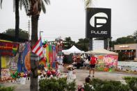 A guest strolls through the parking lot outside the Pulse Nightclub on the one year anniversary of the shooting, in Orlando, Florida