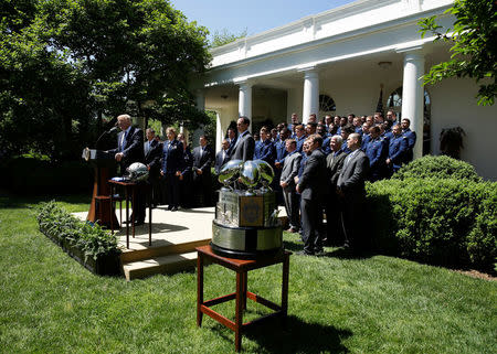U.S. President Donald Trump presents the U.S. Air Force Academy football team with the Commander-in-Chief trophy in the Rose Garden of the White House in Washington, U.S., May 2, 2017. REUTERS/Joshua Roberts