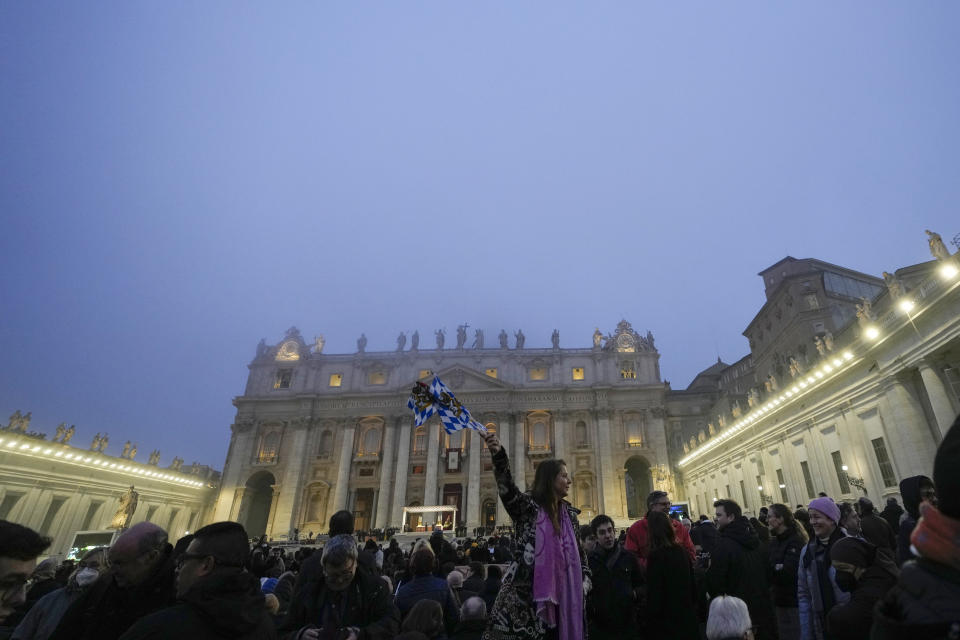 The fog covers the St. Peter's Basilica Dome as people gather in St. Peter's Square at the Vatican ahead of the funeral mass for late Pope Emeritus Benedict XVI, Thursday, Jan. 5, 2023. Benedict died at 95 on Dec. 31 in the monastery on the Vatican grounds where he had spent nearly all of his decade in retirement, his days mainly devoted to prayer and reflection. (AP Photo/Alessandra Tarantino)