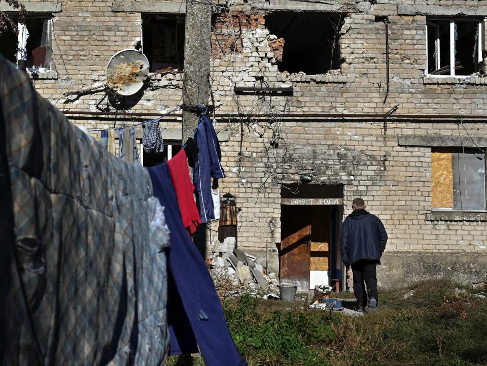 A resident goes to look at a bomb shelter (REUTERS)