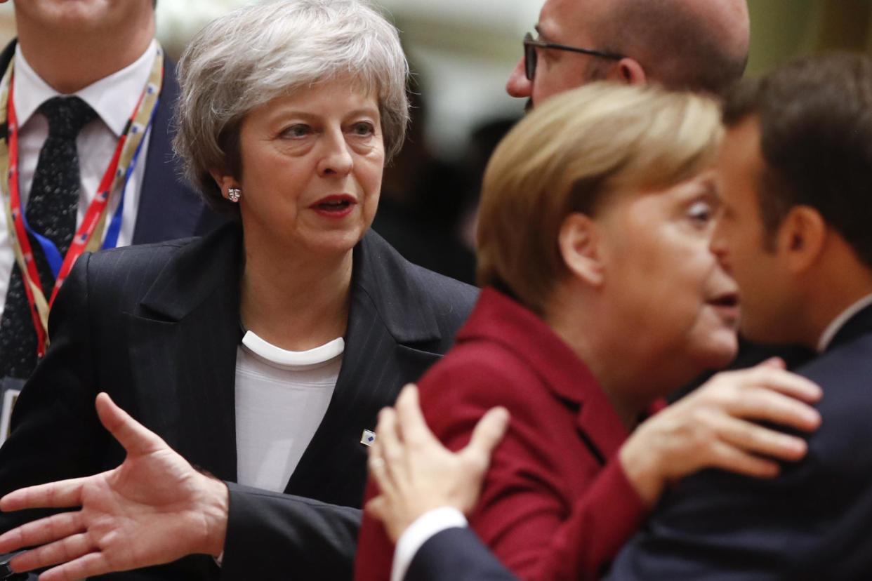 Theresa May, centre, arrives for a round table meeting at an EU summit in Brussels: AP