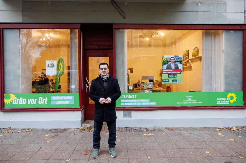 Jian Omar, a German politician of Kurdish-Syrian background, stands in front of his constituency office in Berlin