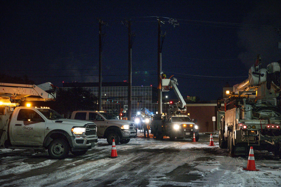 FILE - In this Feb. 18, 2021, file photo, an Oncor Electric Delivery lineman crew works on repairing a utility pole that was damaged by the winter storm that passed through Odessa, Texas. Texas officials on Thursday, March, 25, 2021 raised the death toll from February's winter storm and blackouts to at least 111 people — nearly doubling the state's initial tally following one of the worst power outages in U.S. history.. (Eli Hartman/Odessa American via AP, File)