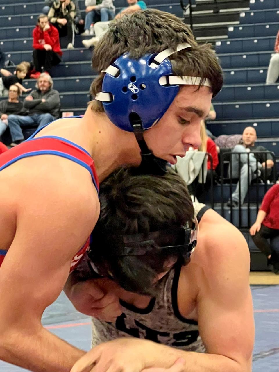 Highland's Caleb Wetzel competes against Clear Fork's Jaxon Swank in the 132-pound finals at last weekend's Mid Ohio Athletic Conference Wrestling Meet in Galion.