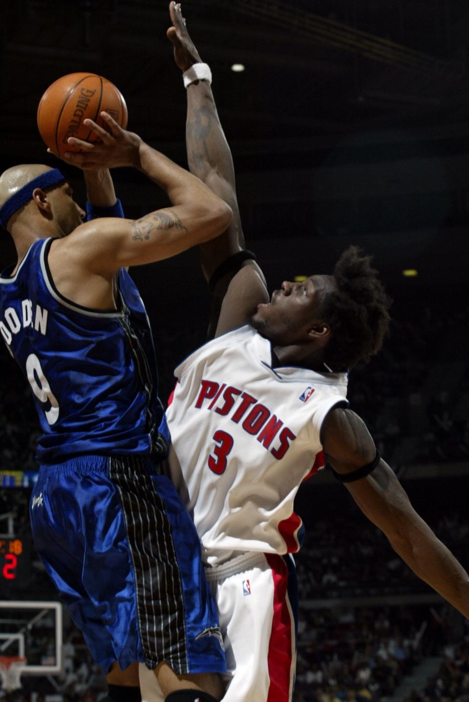 Ben Wallace forces a miss by Orlando's Drew Gooden at the Palace, April 20, 2003 in the playoffs.