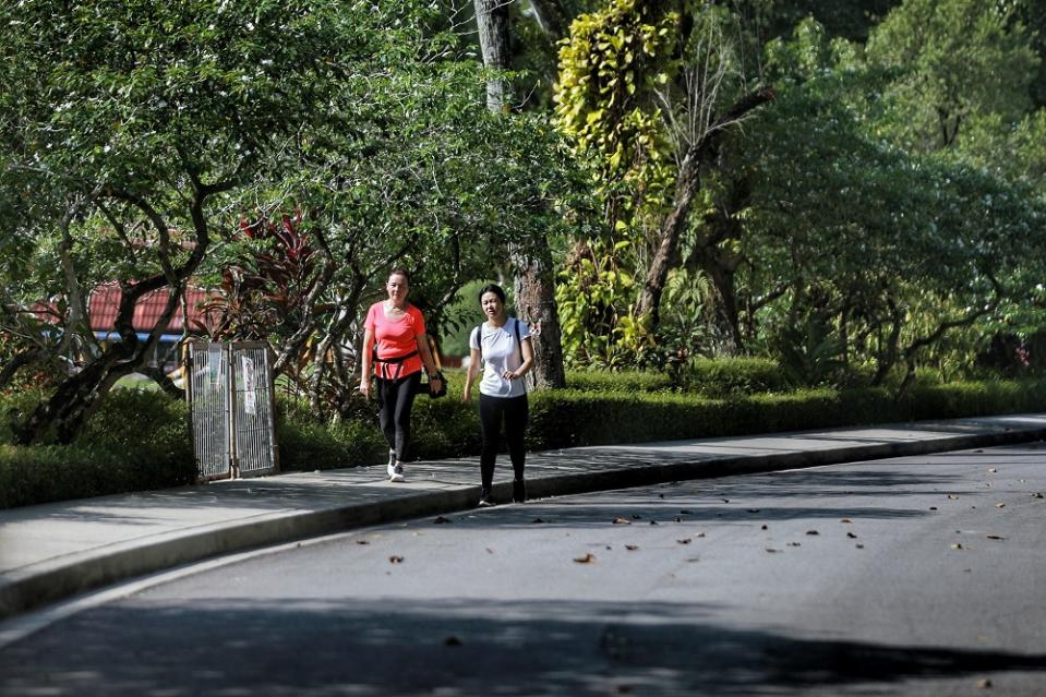 People jog at Taman Botani Perdana in Kuala Lumpur during the CMCO period October 19, 2020.