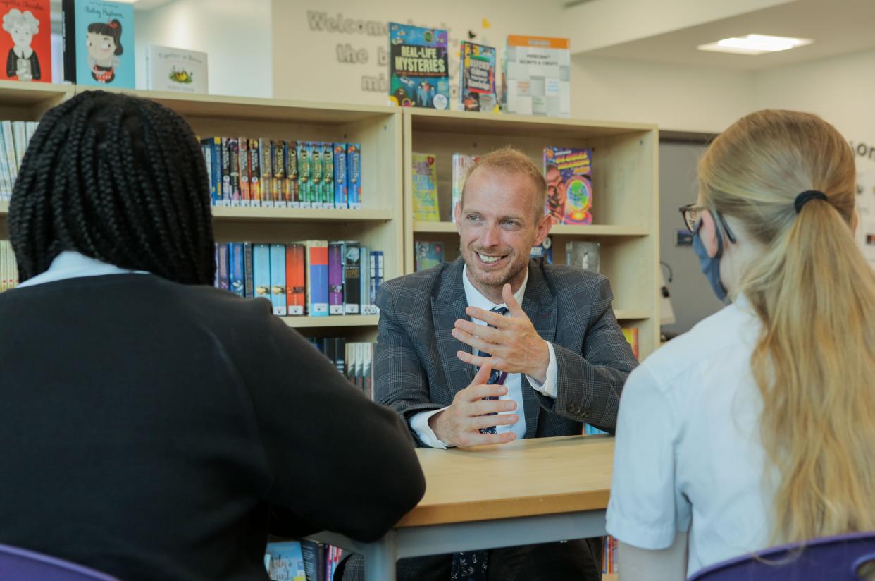 Thomas Raymond talks to pupils at Oasis Academy Arena, Croydon, south east London (Matt Writtle)