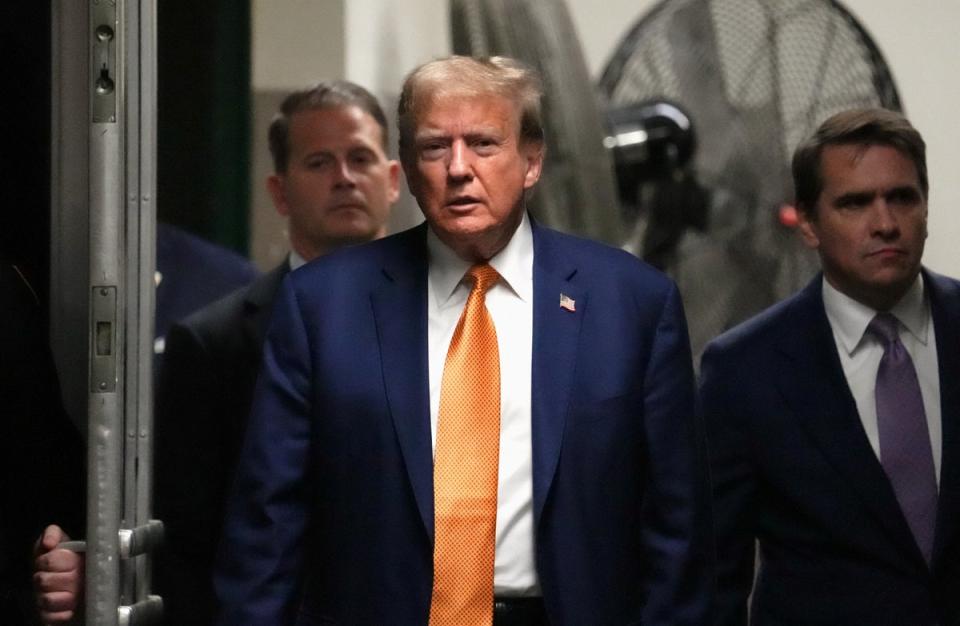 Donald Trump appears in a criminal courtroom in Manhattan on 7 May. (REUTERS)