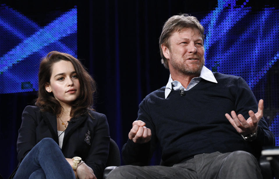 Cast member Sean Bean answers a question, as co-star Emilia Clarke watches, at the HBO panel for the television series "Game of Thrones" during the Television Critics Association winter press tour in Pasadena, California January 7, 2011. REUTERS/Mario Anzuoni (UNITED STATES - Tags: ENTERTAINMENT)