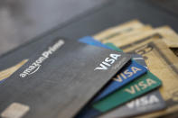 FILE - Credit cards are pictured fanned out in New Orleans, on Aug. 11, 2019. The U.S. economy grew faster than expected in the July-September 2022 quarter, the government reported Thursday, Oct. 27, 2022, underscoring that the United States is not in a recession despite distressingly high inflation and interest rate hikes by the Federal Reserve. But the economy is hardly in the clear. (AP Photo/Jenny Kane, File)