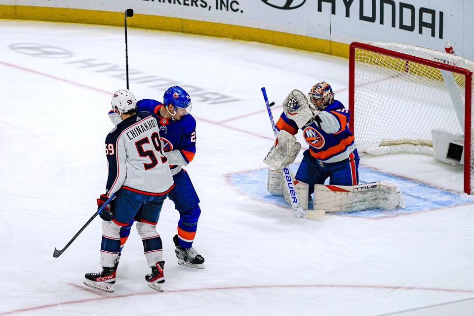 New York Islanders goaltender Ilya Sorokin (30) makes a save during the first period of the team's NHL hockey game against the Columbus Blue Jackets in Elmont, N.Y., Thursday, Dec. 7, 2023. (AP Photo/Peter K. Afriyie)