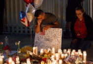 <p>Mourners pay tribute at a makeshift memorial on the Las Vegas Strip for the victims of a mass shooting in Las Vegas, Nevada, USA, 02 October 2017. (Photo: Eugene Garcia/EPA-EFE/REX/Shutterstock) </p>