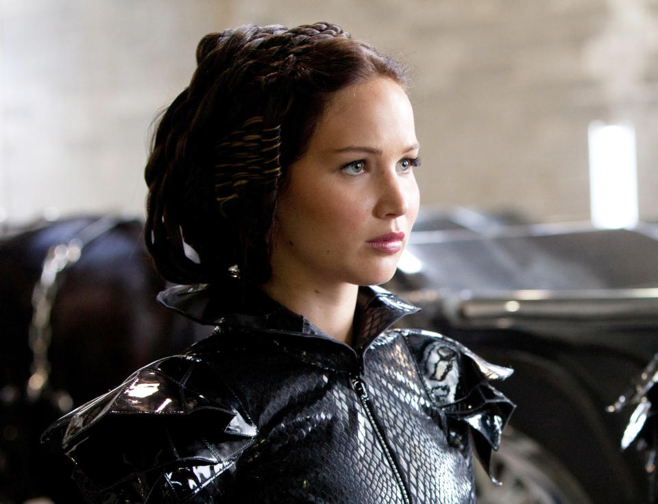 In this file image released by Lionsgate, Jennifer Lawrence portrays Katniss Everdeen in a scene from "The Hunger Games." A staple of the stylish grade-school set, braids have moved from the playground to the red carpet and now, local salons. Salons from Los Angeles to New York and cities in between are weaving "braid bars" into their services, offering special menus of different braid styles for a fixed price. (AP Photo/Lionsgate, Murray Close, File)