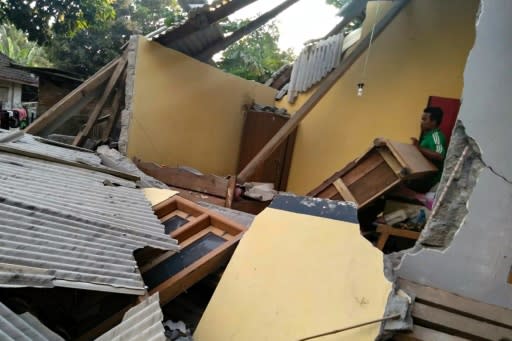 An Indonesian standing among the ruins of a house following the July 29 earthquake in Lombok: a second one struck Sunday