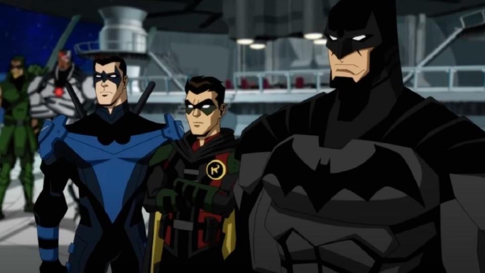 Batman, Nightwing, and Robin in the Justice League Watchtower.