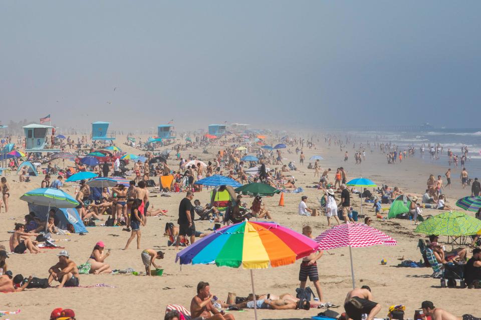 People enjoy the beach amid the pandemic in Huntington Beach, California, on April 25.