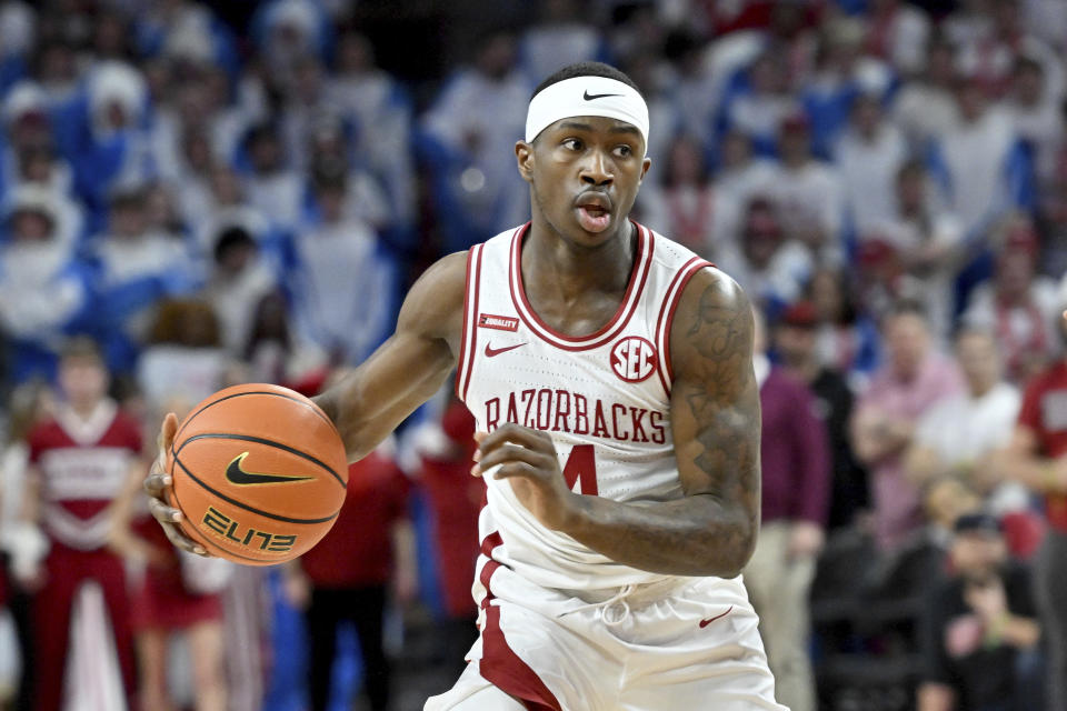 FILE - Arkansas guard Davonte Davis (4) against Kentucky during the first half of an NCAA college basketball game on Feb. 26, 2022, in Fayetteville, Ark. The Razorbacks open at home against North Dakota State on Nov. 7. (AP Photo/Michael Woods, File)