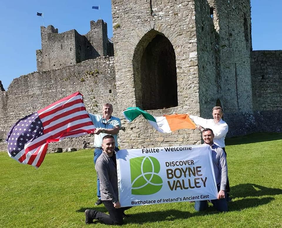 The Irish Boyne Valley Twinning Committee pose with Irish and American flags outside of Trim Castle in County Meath. Pictured (top, from left) are Mick Hughes, Gerry Meade, (bottom, from left) Micheal Kerr and David Gorey.