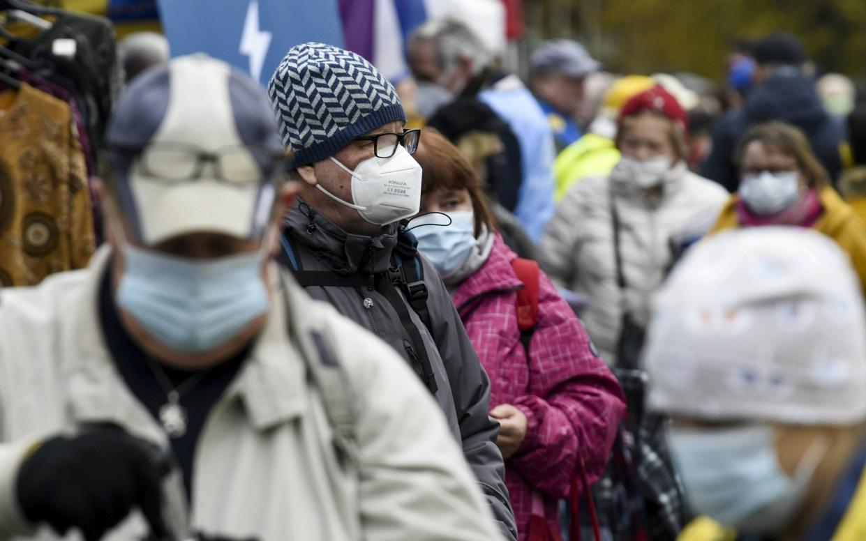 Masked shoppers at an outdoor Finish market - Lehtikuva/Markku Ulander/Reuters