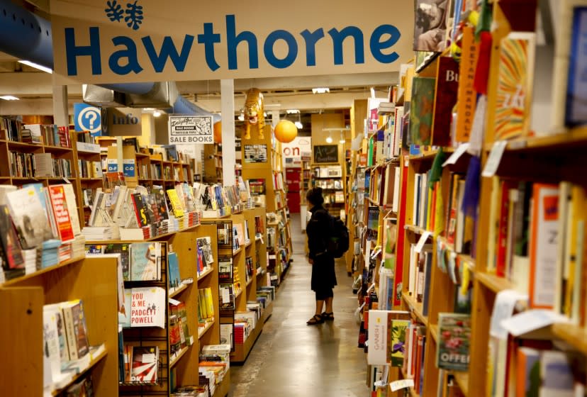 Customer browse the shelves at Powell's Books.