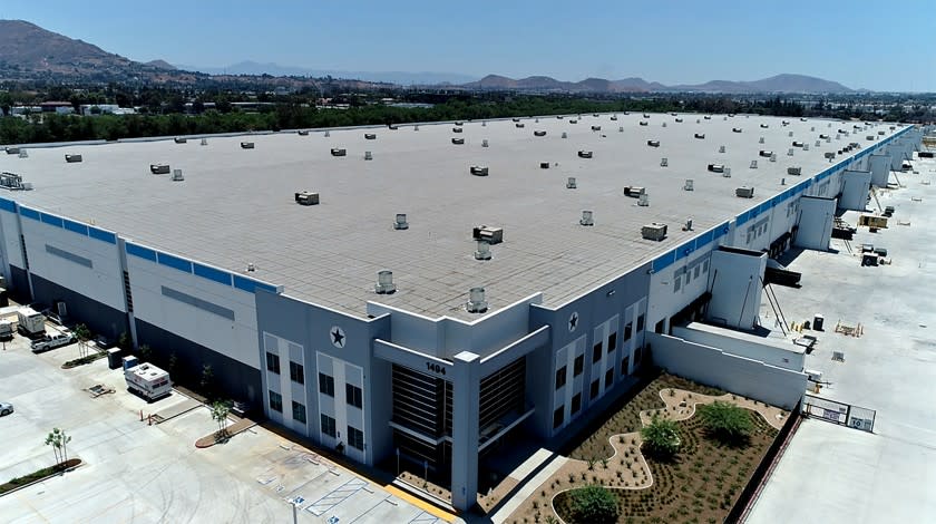 The sale of a portfolio of large-scale shipping centers underscores the rapid growth of online shopping during the pandemic. Pictured: The warehouse is a 2-million-square-foot complex at Van Buren Boulevard and I-215 in Riverside, which is said to be part of a $2-billion deal. (Eastdil Secured)