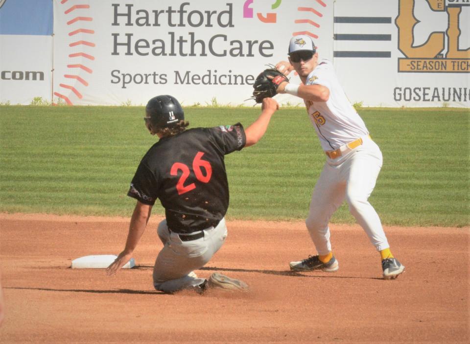 Norwich shortstop Zach Donohue looks to turn a double play against Nashua at Dodd Stadium.