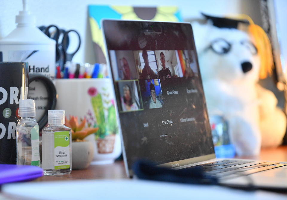 ALBUQUERQUE, NEW MEXICO - AUGUST 17:  Bottles of hand sanitizer sit next to a laptop showing a Zoom meeting as students begin classes amid the coronavirus (COVID-19) pandemic on the first day of the fall 2020 semester at the University of New Mexico on August 17, 2020 in Albuquerque, New Mexico. To help prevent the spread of COVID-19, the university has moved to a hybrid instruction model that includes a mixture of in-person and remote classes. According to the school, about 70 percent of classes are being taught online.  (Photo by Sam Wasson/Getty Images)