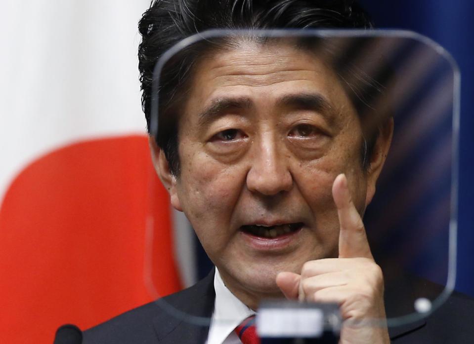 FILE - In this March 20, 2014 file photo, Japanese Prime Minister Shinzo Abe speaks during a press conference at his official residence in Tokyo. Japan is marking the 67th anniversary of its postwar constitution on May 3, 2014 with growing debate over whether to revise the war-renouncing document as Abe pushes for an expanded role for the military. Abe’s ruling conservative party has long advocated revision but been unable to sway public opinion. Now he proposes that the government reinterpret the constitution so it can loosen the reins on its military without having to win approval for constitutional change. (AP Photo/Shizuo Kambayash, File)