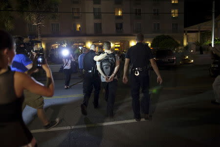 A suspect is arrested as police respond to a shooting at the Emanuel AME Church in Charleston, South Carolina June 17, 2015. REUTERS/Randall Hill