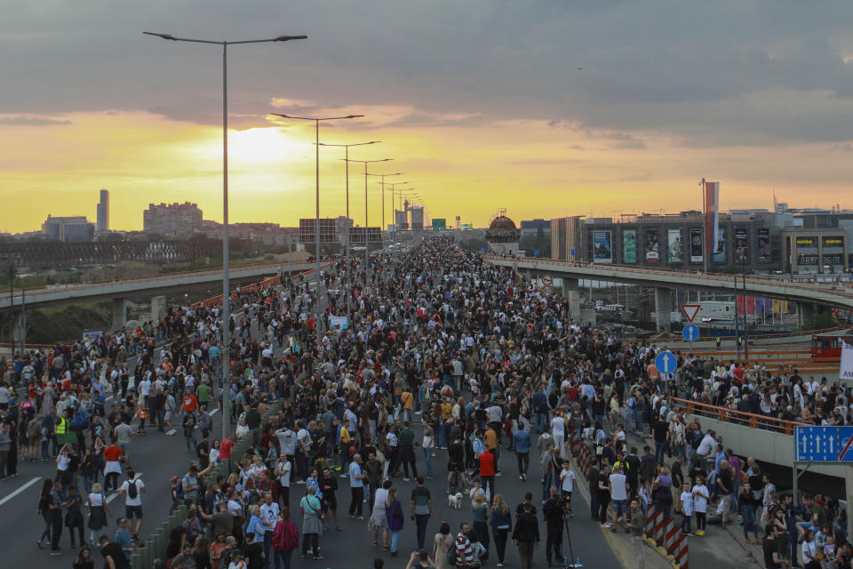 People march on a highway during a protest against violence in Belgrade, Serbia, Saturday, June 17, 2023. Tens of thousands of anti government protesters have staged marches in Belgrade and other Serbian towns against Serbian President Aleksandar Vucic, pledging to “radicalize” weeks of peaceful gatherings that have shaken his autocratic rule. The demonstrators in Belgrade blocked the main highway that leads through the capital and chanted slogans for Vucic to resign, something that he has repeatedly rejected. (AP Photo/Milos Miskov)