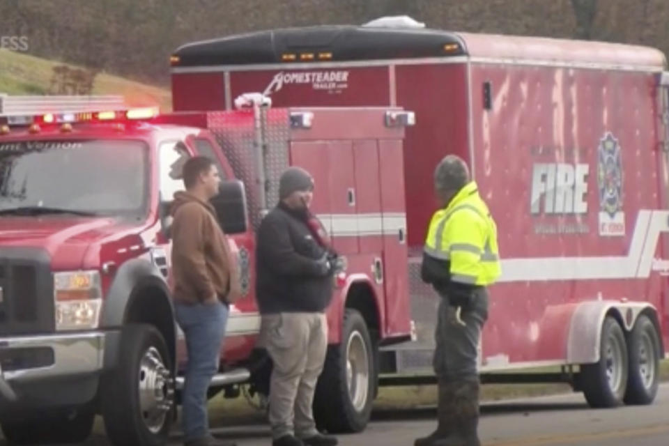 Emergency responders work at the scene of a derailment of a CSX train north of Livingston, Ky., on Wednesday, Nov. 22, 2023. Two of the railcars were carrying molten sulfur and at least one of them was breached, causing a fire that burned until Thursday. (WTVQ via AP Photo.)