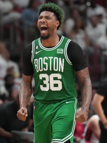 <p>Jesse D. Garrabrant/NBAE/Getty</p> Marcus Smart #36 of the Boston Celtics celebrates during Game Six of the Eastern Conference Finals in 2023