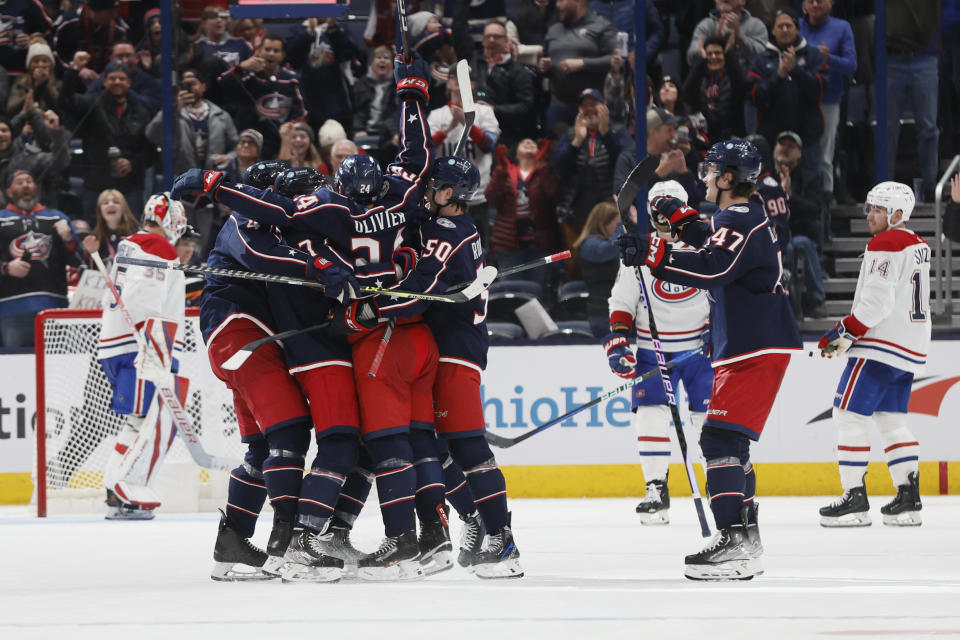 Columbus Blue Jackets players celebrate after their goal against the Montreal Canadiens during the third period of an NHL hockey game Thursday, Nov. 17, 2022, in Columbus, Ohio. (AP Photo/Jay LaPrete)