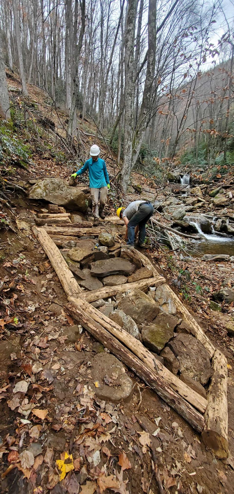 Pisgah Area SORBA volunteers build a rock crib to hold together a section of rock armoring on Farlow Gap Trail that was significantly affected by Tropical Storm Fred.