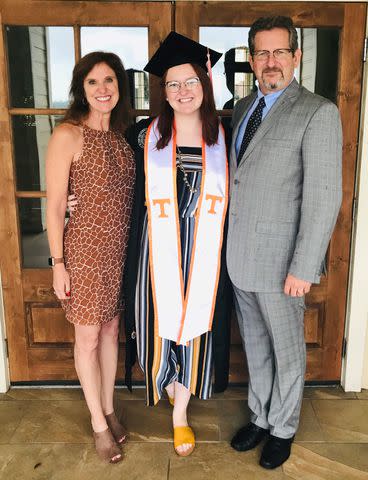 <p>Katie Garapic</p> Katie Garapic with her parents Rebecca and Peter Garapic