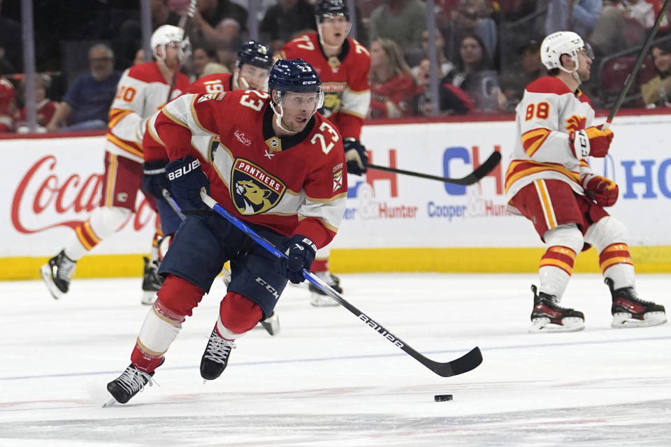 Florida Panthers center Carter Verhaeghe (23) skates with the puck during the second period of an NHL hockey game against the Calgary Flames, Saturday, March 9, 2024, in Sunrise, Fla. (AP Photo/Lynne Sladky)