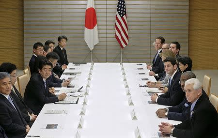 U.S. House of Representatives Ways and Means Committee Chairman Paul Ryan (3rd R), leading a congressional delegation, meets with Japan's Prime Minister Shinzo Abe (3rd L) for talks on Trans-Pacific Partnership (TPP) and other issues at Abe's official residence in Tokyo February 19, 2015. REUTERS/Kimimasa Mayama/Pool