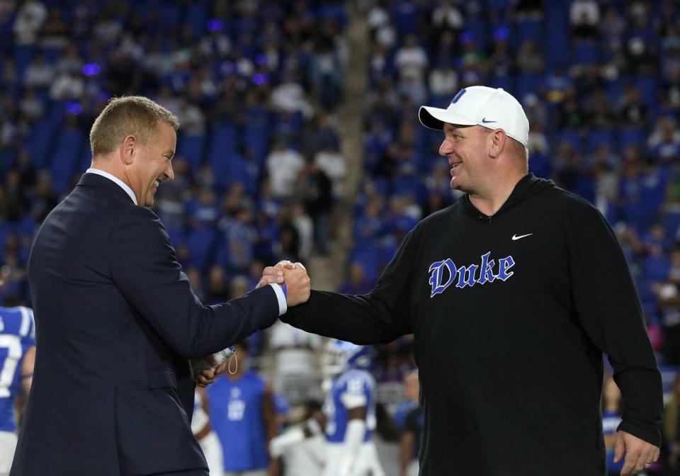 Duke head coach Mike Elko greets ESPN’s Kirk Herbstreit prior to the Blue Devils’ game against Notre Dame at Wallace Wade Stadium on Saturday, Sept. 30, 2023, in Durham, N.C.