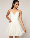 <b>Wicked in white</b><br><br> An updated take on a classic style, this white bandeau frock has a fringed skirt, fitted bodice and very modern neckline. It's a great wardrobe piece that pairs past and present in a glamorous way. <br><br>Aqua flapper dress £75 from <a href="http://www.asos.com/countryid/1/Aqua/Aqua-Flapper-Structured-Fringe-Bandeau-Dress/Prod/pgeproduct.aspx?iid=1852200&cid=5235&Rf900=1465&sh=0&pge=5&pgesize=200&sort=-1&clr=Cream&MID=35718&affid=2134&siteID=0RpXOIXA500-dJe2bB5vkNPkjorCR5y0GA" rel="nofollow noopener" target="_blank" data-ylk="slk:asos.com;elm:context_link;itc:0;sec:content-canvas" class="link ">asos.com</a>