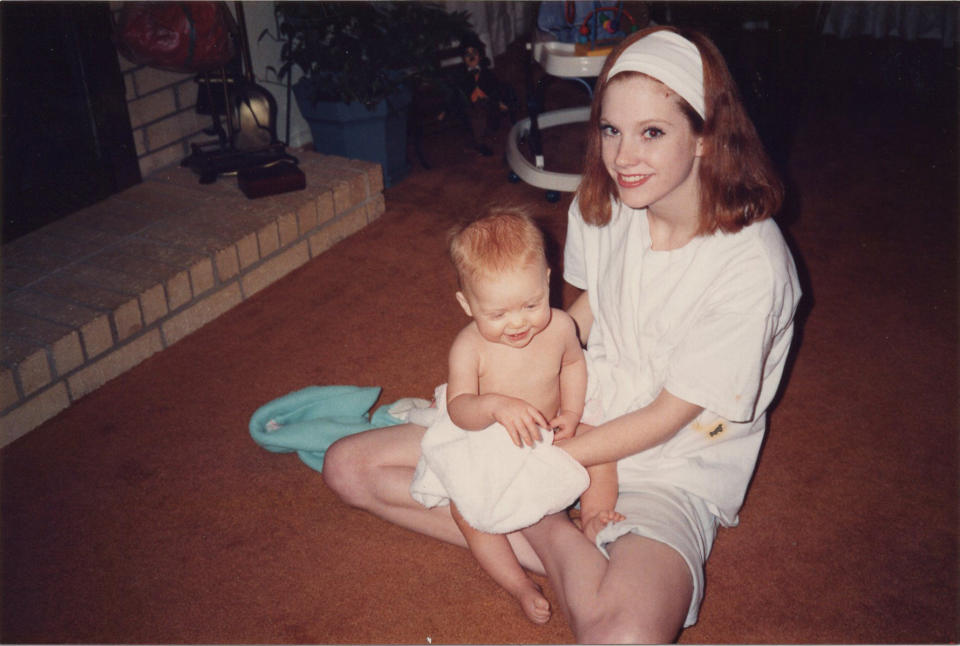 Julie Oliver as a teenager, with her then-infant eldest daughter, Nicki. (Photo: HuffPost)