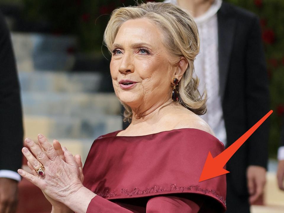 Hillary Clinton at met gala in red dress with embroidered names