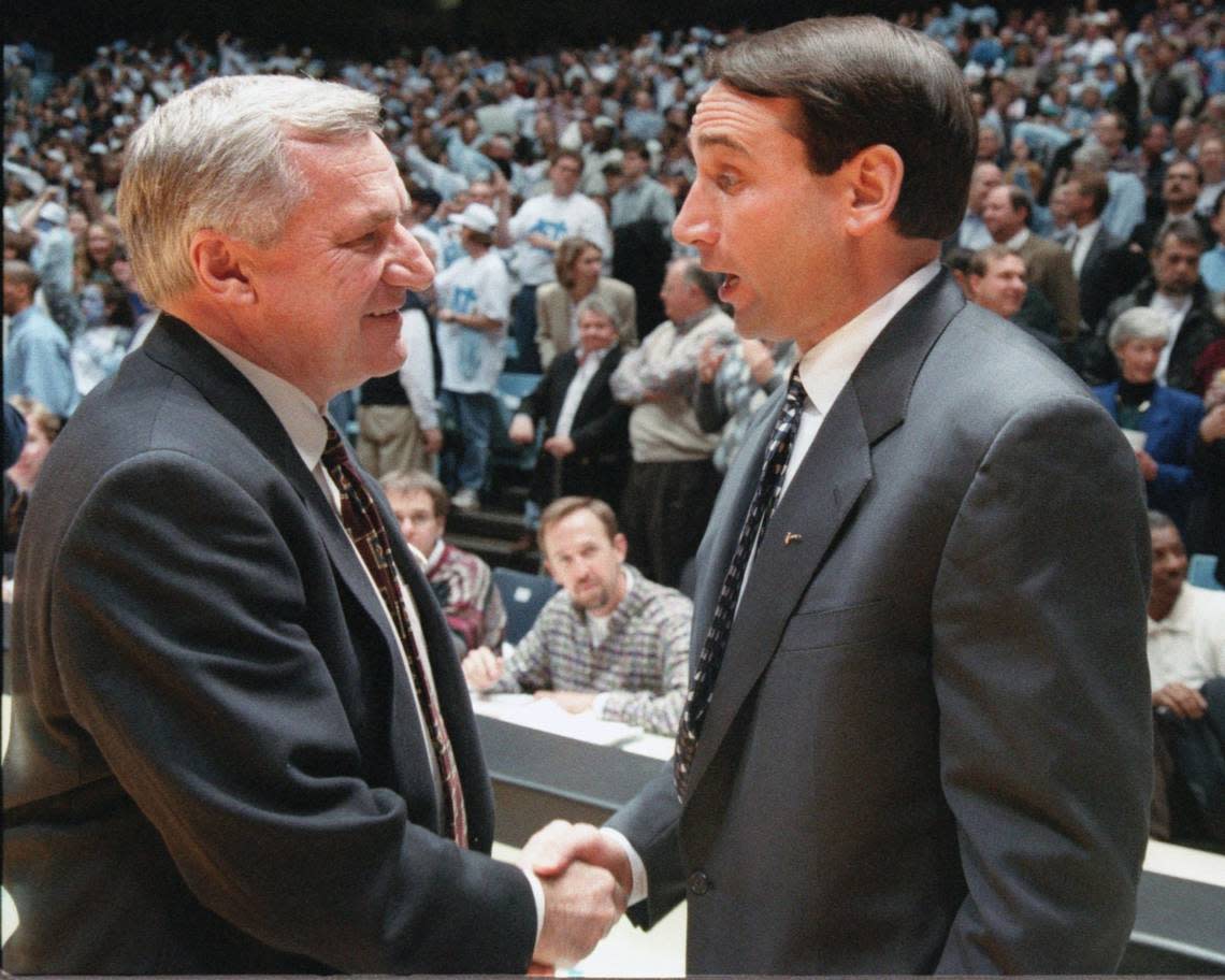 North Carolina coach Dean Smith and Duke coach Mike Krzyzewski shake hands before theur game,at UNC in 1996.