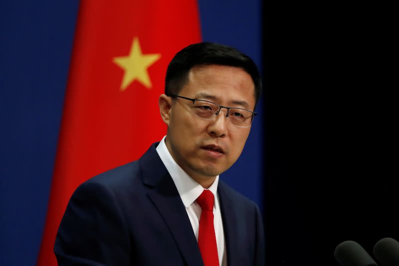 FILE PHOTO: Chinese Foreign Ministry spokesman Zhao Lijian attends a news conference in Beijing, China