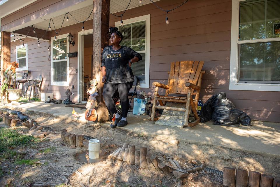 Yolanda R. Brinston, owner of a Habitat for Humanity built house on Smith Robinson Street in Jackson has been dealing with raw sewage issues at her home for years. Brinston, standing outside her home Tuesday, Oct. 24, explained that if she doesn't unscrew the lid to the sewage pipe in her front yard, sewage backs up into the house. The smell of raw sewage permeates the air.