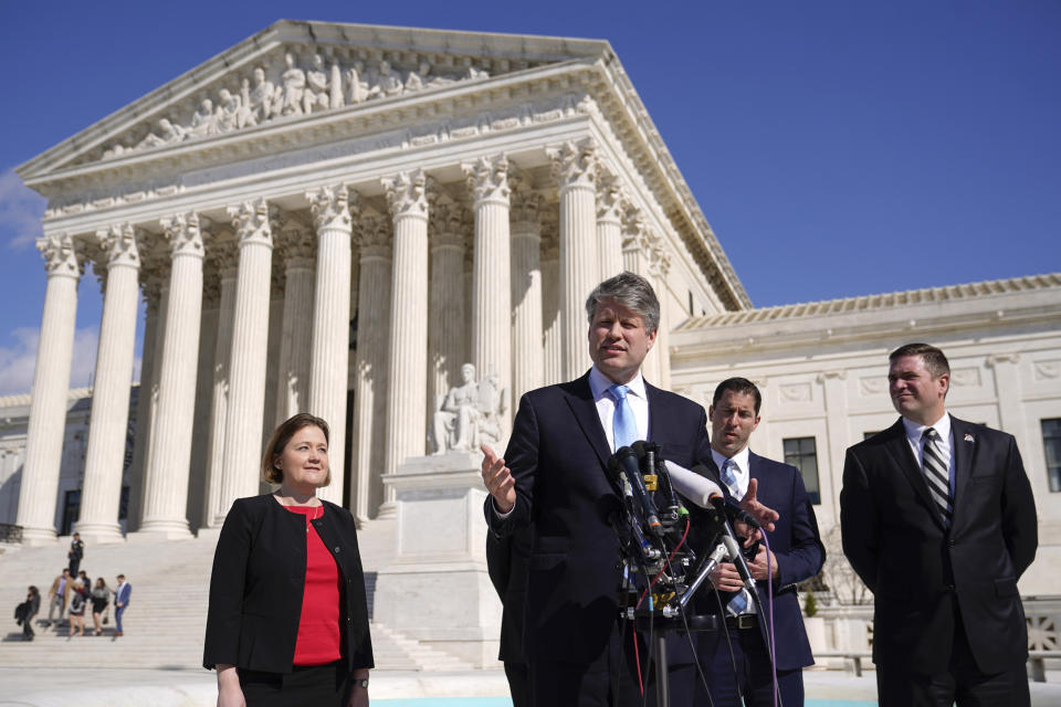 Nebraska Attorney General Mike Hilgers speaks with reporters outside the Supreme Court on Capitol Hill in Washington, Tuesday, Feb. 28, 2023, after the court heard arguments over President Joe Biden's student debt relief plan. Standing behind Hilgers are Iowa Attorney General Brenna Bird, from left, Nebraska Solicitor General Jim Campbell and Missouri Attorney General Andrew Bailey. (AP Photo/Patrick Semansky)