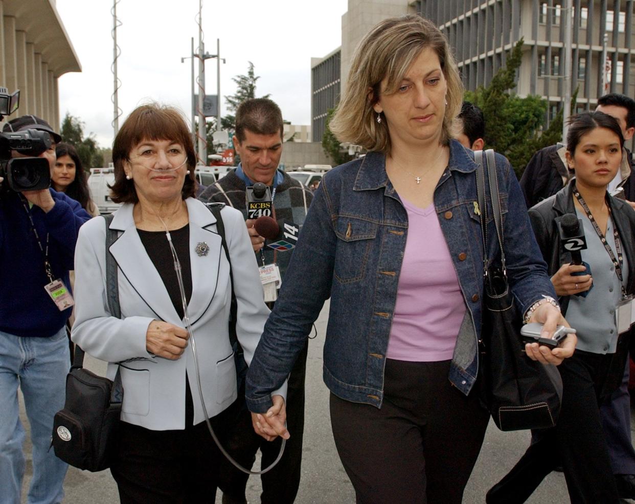 Jackie Peterson, left, mother of convicted double murderer Scott Peterson and her daughter-in-law Janey Peterson, right, leave a Redwood City, Calif., courthouse, Friday, Feb. 25, 2005 after a hearing to set the final sentencing date. Scott Peterson is  the Modesto, Calif., man who was convicted for the murder of his wife, Laci Peterson, and their unborn son. (AP Photo/Paul Sakuma)