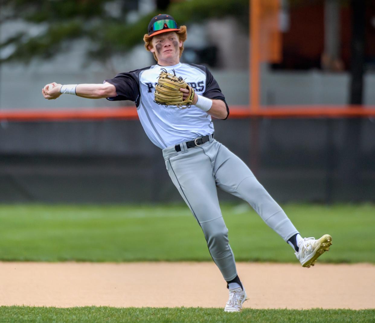 Washington's Easton Harris makes a running throw to first base during a recent game against Springfield at Washington Community High School.