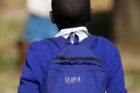 Seven-year-old Barack Obama, named after U.S. President Barack Obama, walks at the Senator Obama primary school in Kogelo village west of Kenya's capital Nairobi, July 16, 2015. U.S. President Barack Obama visits Kenya and Ethiopia later this month. His ancestral home of Kogelo is home to Sarah Hussein Obama, his step-grandmother. The Kenyan village, burial place of Obama's father, features an open-pit goldmine, a pork butcher's, a school named after their most famous son and outdoor market stalls. Villagers get around by motorbike taxi or on foot while a donkey-cart transports water. Children, some of them named Obama in honour of the President, walk to and from school together. Picture taken July 16, 2015. (REUTERS/Thomas Mukoya)